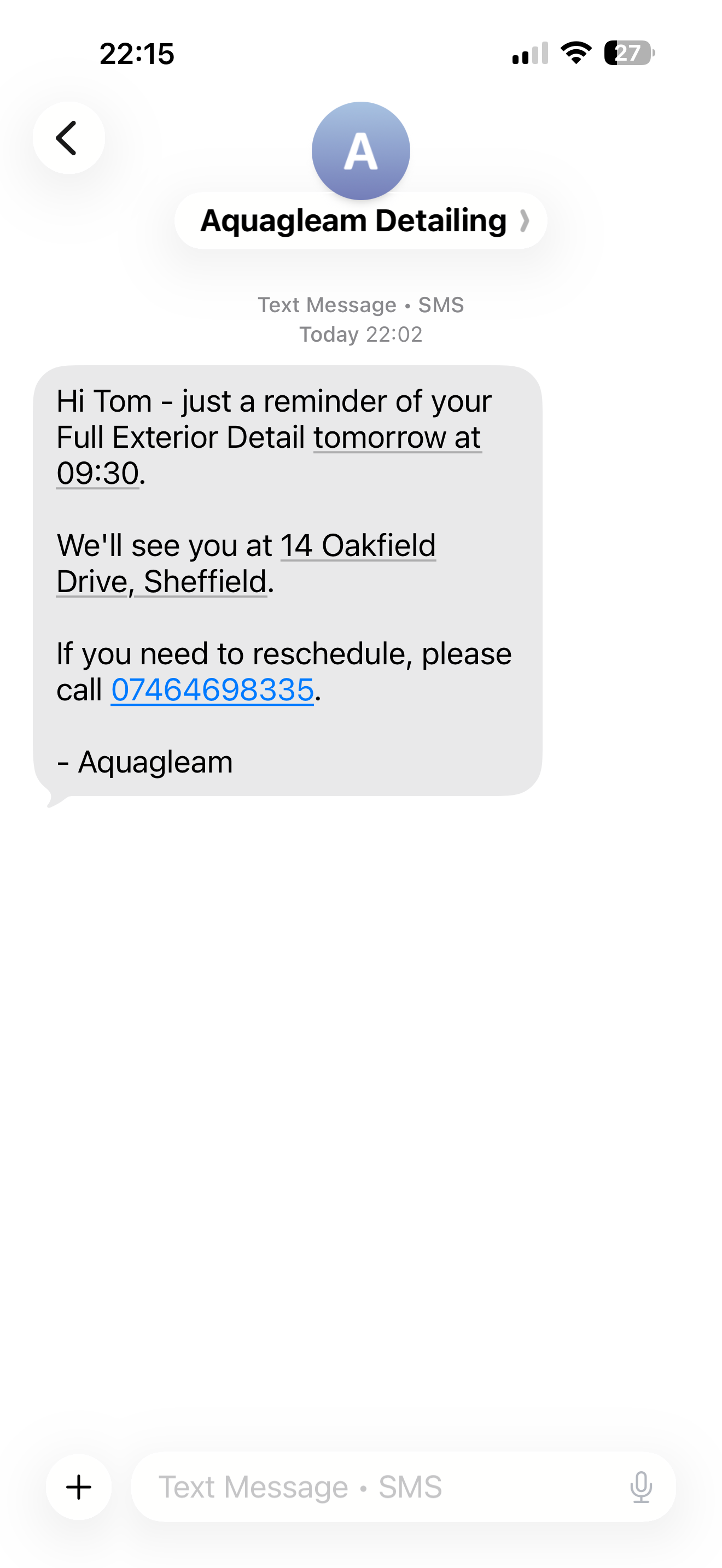 iPhone showing DetailBook SMS appointment reminder in Messages app